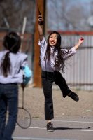 A young girl plays with friends during youth group activities at a Vietnamese temple in Albuquerque, New Mexico. - © Adam Stoltman. All rights reserved.