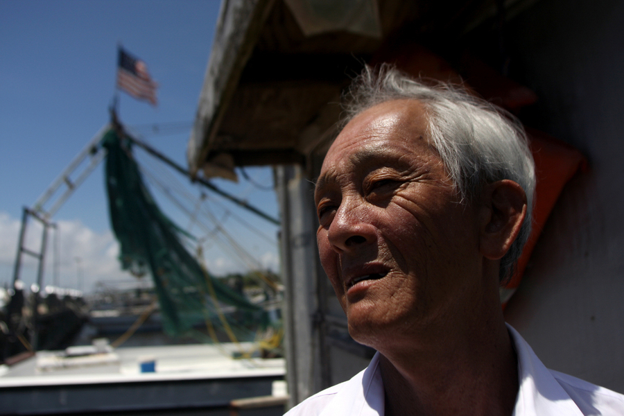 Bien Do, a shrimper who has made his living fishing in the Gulf for 30 years and who was hard hit by the BP oil spill, is shown on one of the two boats he owns in Pass Christian, Mississippi. : Capturing Culture : Photography by Adam Stoltman: Sports Photography, The Arts, Portraiture, Travel, Photojournalism and Fine Art in New York