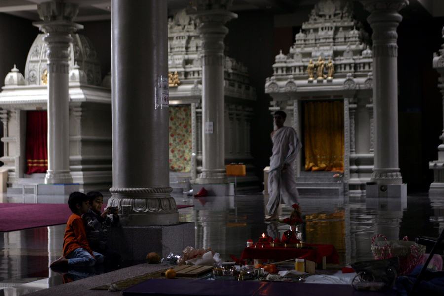 Children play with devices following services at the Hindu Society of Minneapolis in Maple Grove, Minnesota. It is the largest Hindu temple in North America. : Capturing Culture : Photography by Adam Stoltman: Sports Photography, The Arts, Portraiture, Travel, Photojournalism and Fine Art in New York