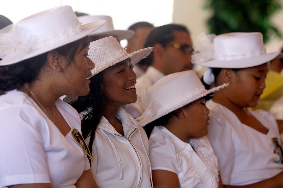Young girls take part in a Samoan Church service in Carson, California.  More than 20,000 Samoans have settled in the Los Angeles area. The Samoan National Nurses Association (SNNA) was established as a non-profit organization
in order to serve the Pacific Islander Community to provide education, resources, guidance and services aimed at promoting health and preventing diseases that disproportionately affect this group, such as diabetes, heart disease, and certain kinds of cancer. With funding from HTA, the SNNA has collaborated with faith-based organizations in the Samoan community, working with pastors, community leaders, and others to provide health information. This includes encouraging regular check-ups and screening for chronic conditions, as well as educating about access to health insurance, which one in four Native Hawaiians and Pacific Islanders under the age of 65 lacks. : Capturing Culture : Photography by Adam Stoltman: Sports Photography, The Arts, Portraiture, Travel, Photojournalism and Fine Art in New York