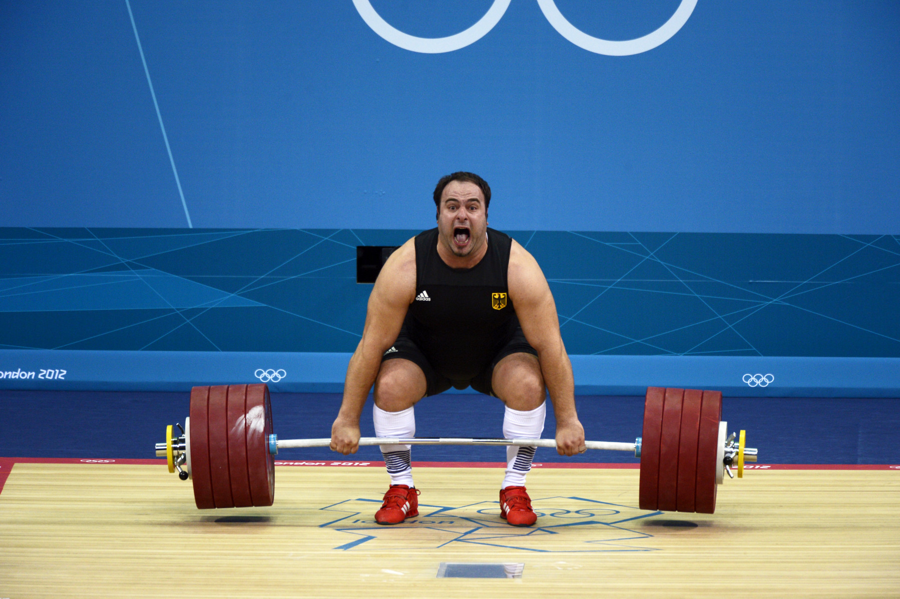 Almir Velagic of Germany attempting a lift in the Men's +105kg Weightlifting Competition.  : London Olympics : Photography by Adam Stoltman: Sports Photography, The Arts, Portraiture, Travel, Photojournalism and Fine Art in New York