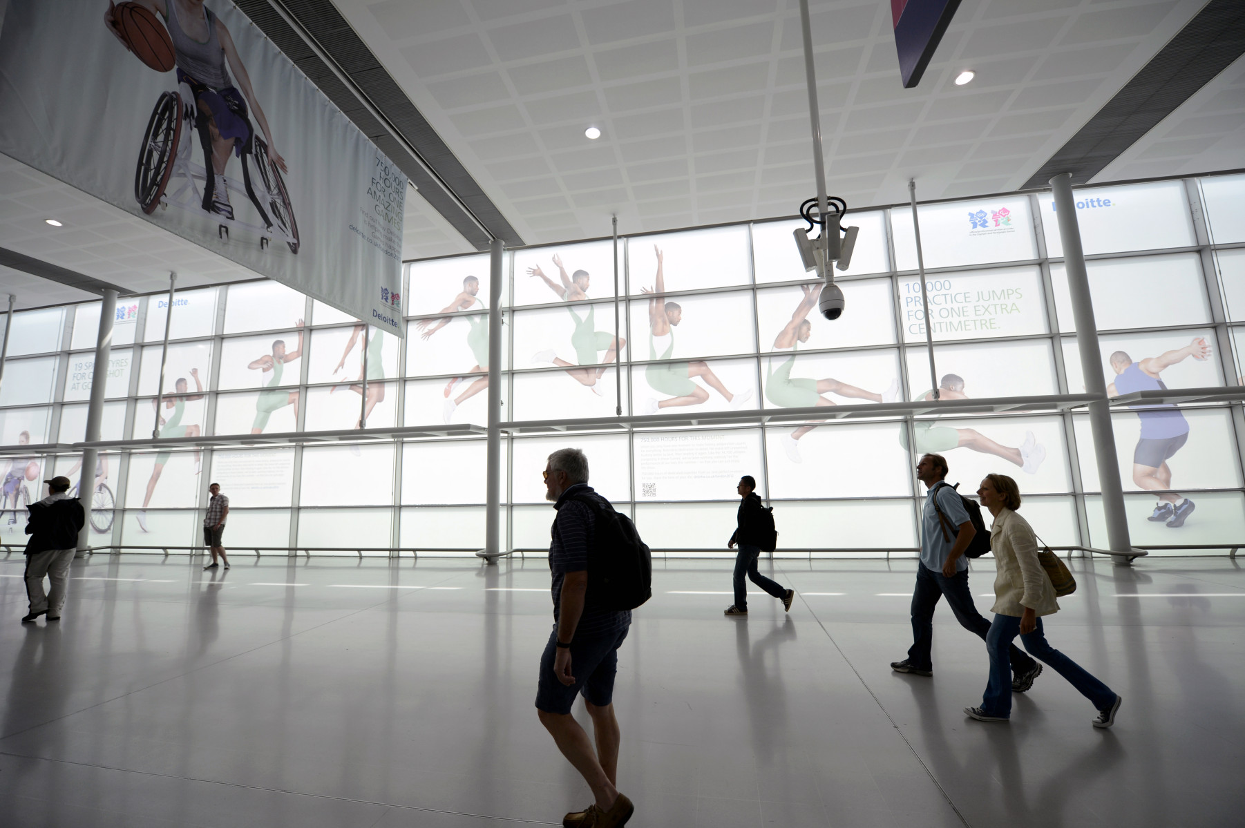 Specators walking through train station, London Olympics : London Olympics : Photography by Adam Stoltman: Sports Photography, The Arts, Portraiture, Travel, Photojournalism and Fine Art in New York