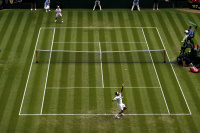 <h4 style="text-transform:uppercase">Roger Federer on Centre Court at Wimbledon</h4>
<div class="captiontext">
The pristine lawn of Centre Court at Wimbledon through most of the 2000's has felt like Roger Federer's home.  His presence when on this most hallowed ground, can be felt like an aura and a force when he sets foot there, and his eight Wimbledon titles still the most by any male player.  Here he serves on this legendary court in 2018.
</div>




 - © Adam Stoltman. All rights reserved.