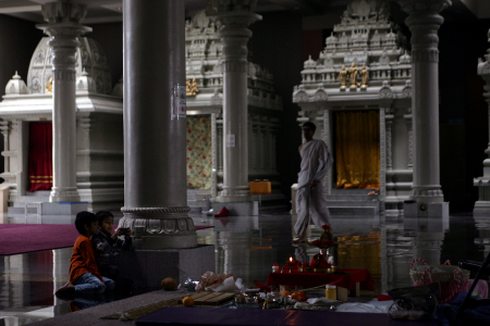 Children play with devices following services at the Hindu Society of Minneapolis in Maple Grove, Minnesota. It is the largest Hindu temple in North America.