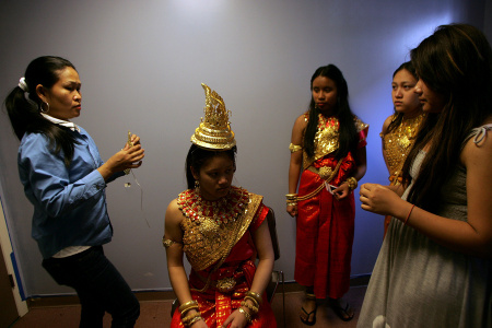 Teenagers getting ready to perform traditional Cambodian dances during a New Years celebration event at the Socio-Economic Development Center (SEDC) for
Southeast Asians in Providence, Rhode Island. Providence is home to a population of approximately 20,000 people originally from Cambodia, Laos, Thailand, Vietnam,
and other countries of Southeast Asia. Since 1987 SEDC has worked to mobilize and to educate the public in Rhode Island on health issues facing the community,
including the high numbers of Southeast Asians without health insurance. Utilizing an HTA grant, SEDC is helping to close that gap by assisting community members
in applying for insurance under existing programs or with signing up for coverage through the Affordable Care Act.