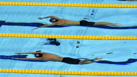 Michael Phelps and United States teammate, Ryan Lochte competing in the semifinals of the 200 meter individual medley during the 2012 London Olympics.  Phelps finished first in the event to take the gold medal, while Lochte was second with the silver. 