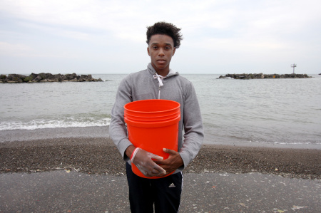Antuoine Hunt during a beach clean up on Lake Erie, for the C.S. Mott Foundation